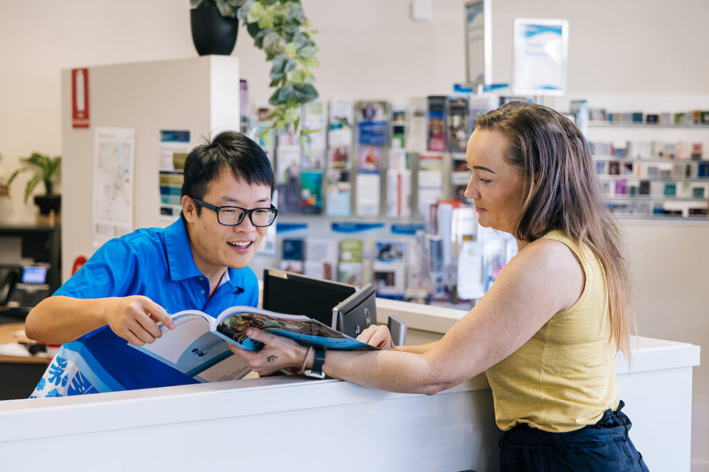 A TCIC volunteer assisting a community member